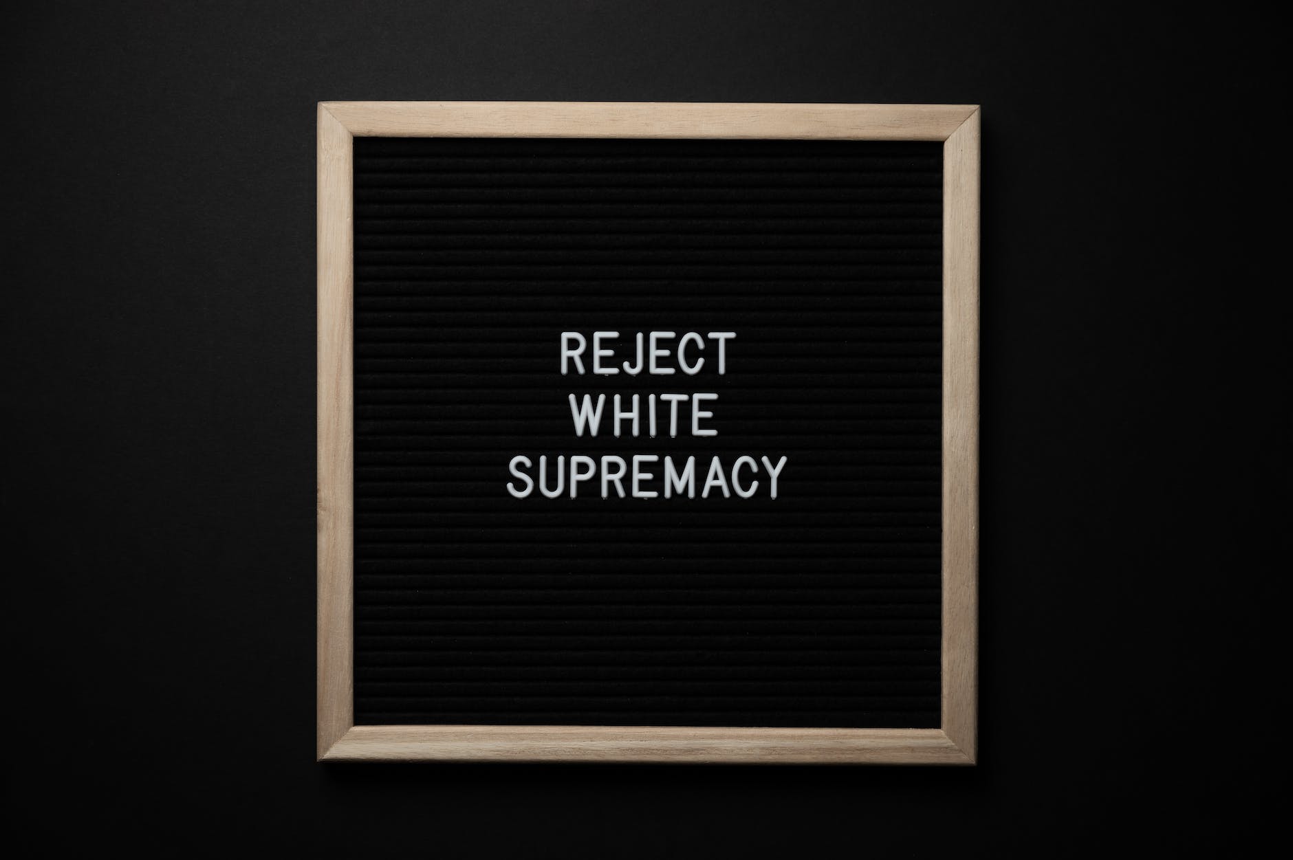 chalkboard with reject white supremacy inscription